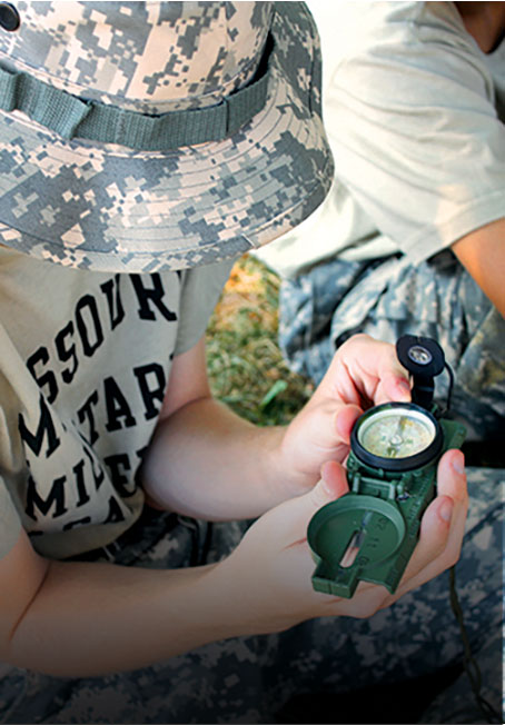 Boy holding a compass