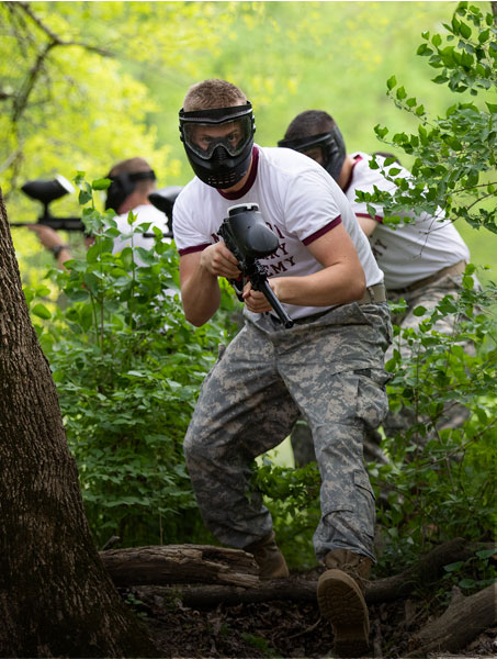 Teenage boy in paintball gear