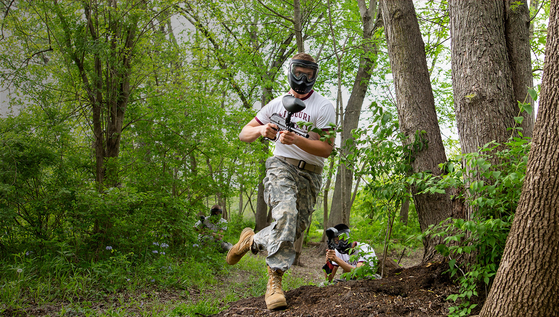 Teenage boy in paintball gear