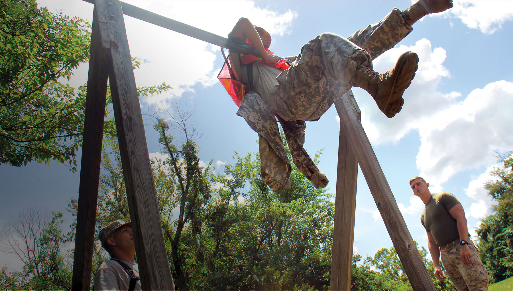 Teenage boy completing the obstacle course